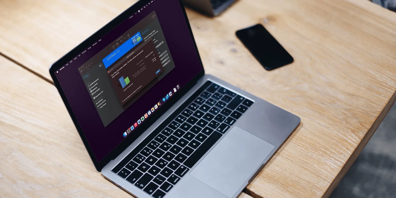MacBook Pro on a table with WinZip app open inside