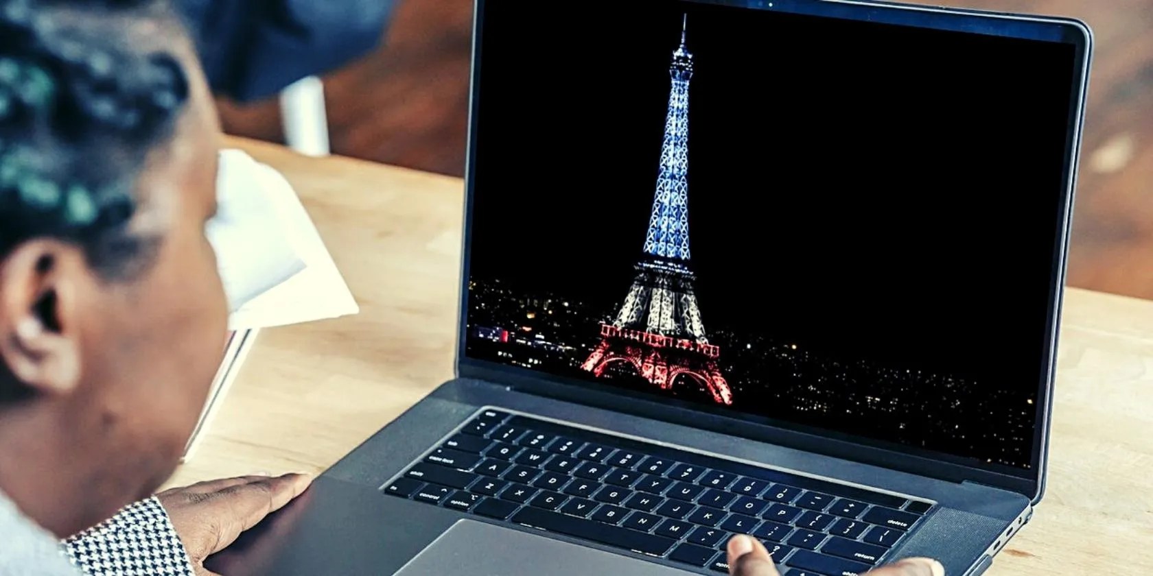 African-American woman using MacBook Pro