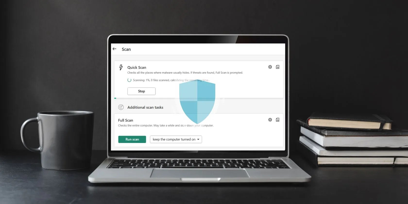 A laptop computer is seen on a desk during an antivirus scan