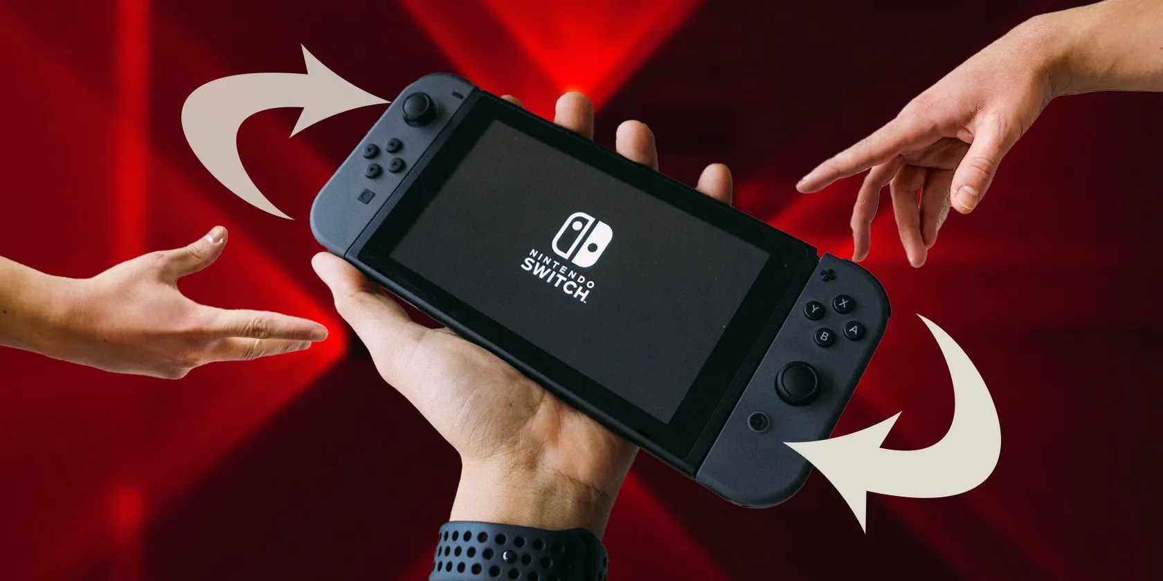 Nintendo Switch with hands reaching for it