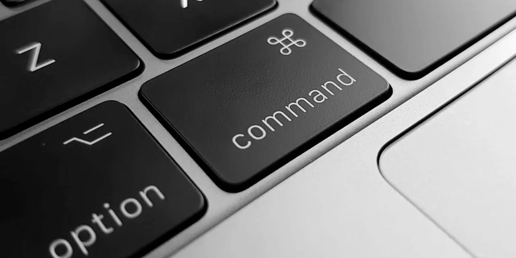 A close up of the Mac command keyboard button