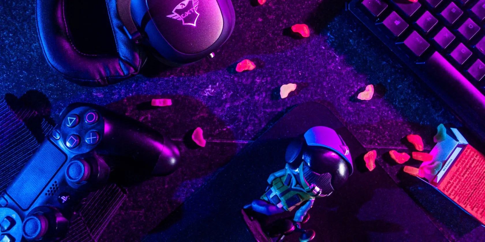 Controller keyboard and headset resting on a table