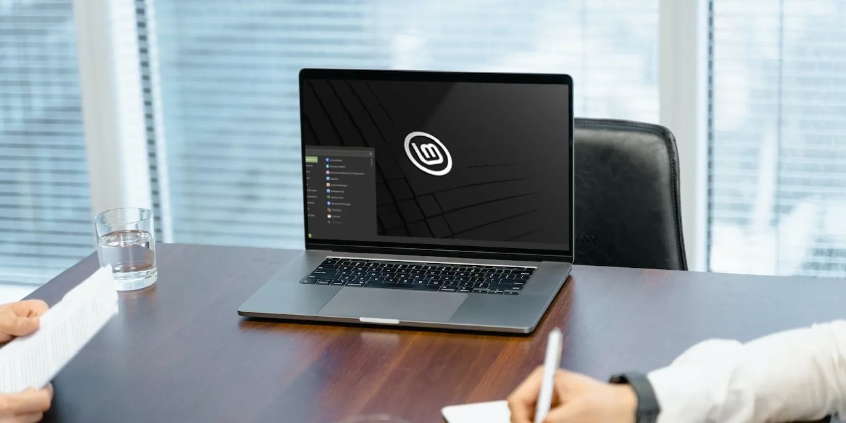 a laptop running Linux Mint on a table