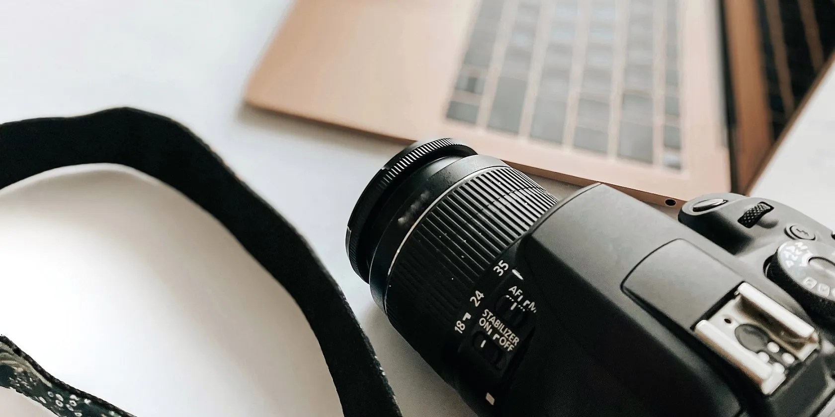 Photo of a camera and laptop
