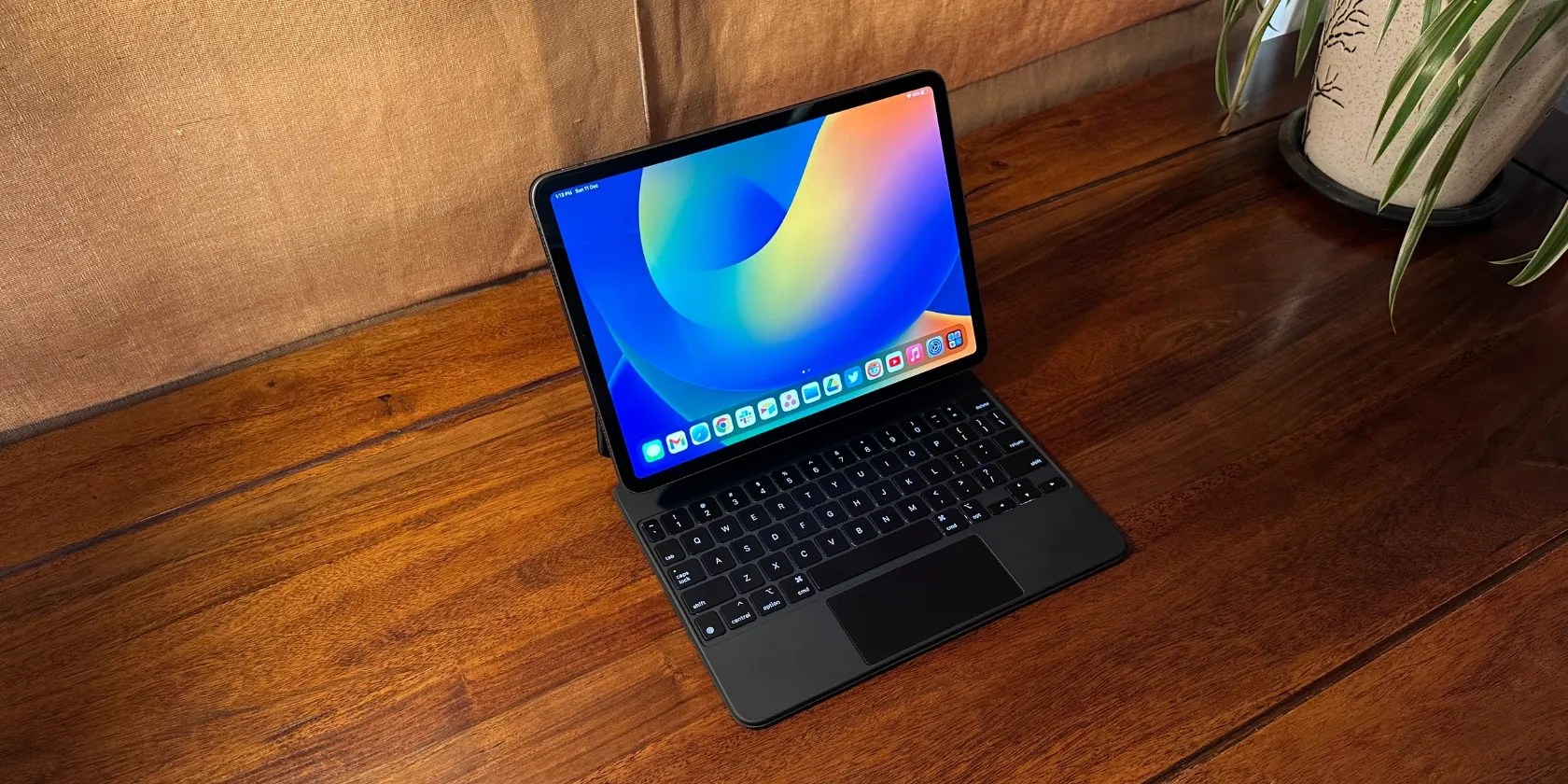 iPad Pro attached to Magic Keyboard placed on a table