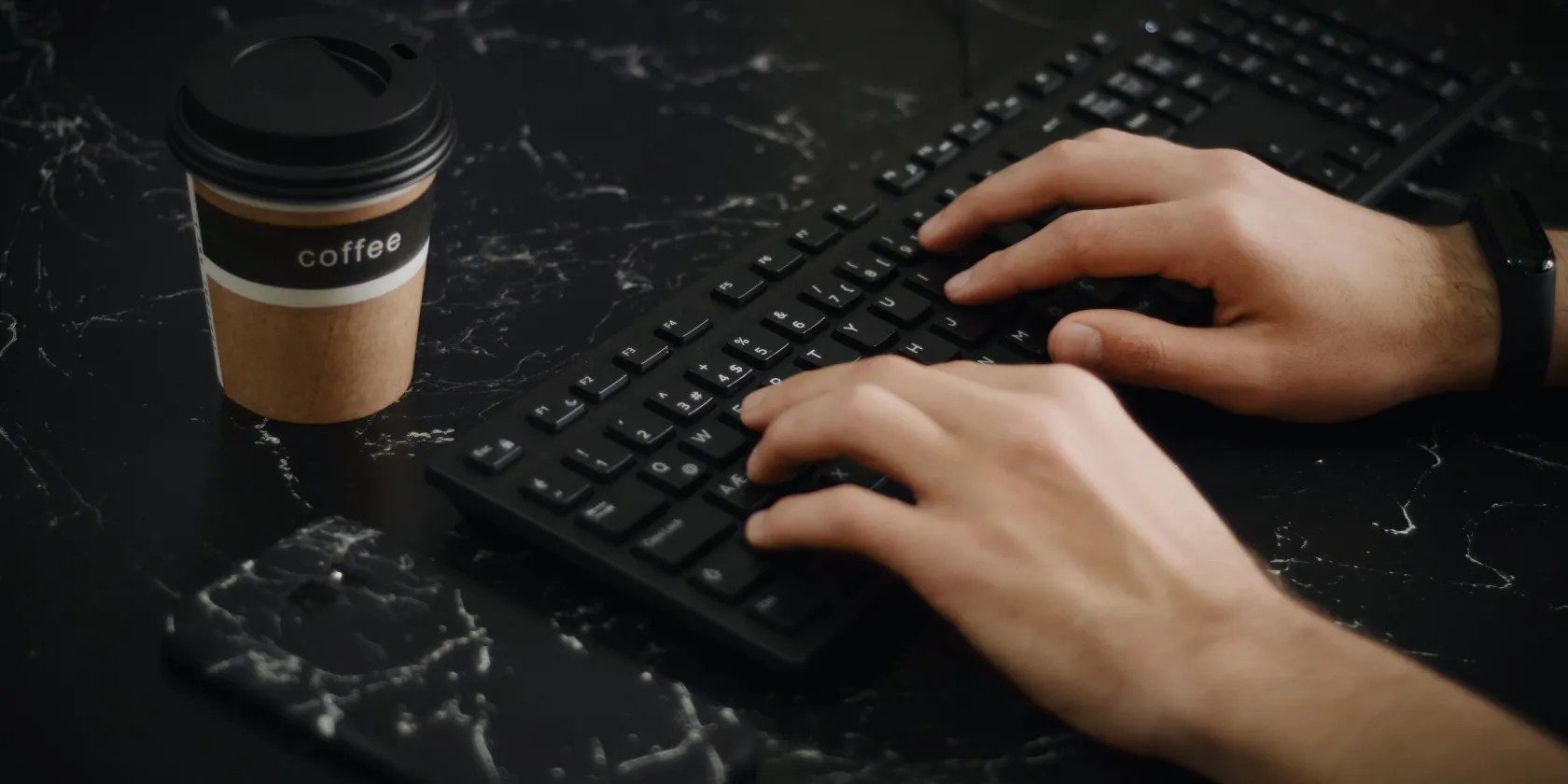 Person typing on a computer keyboard