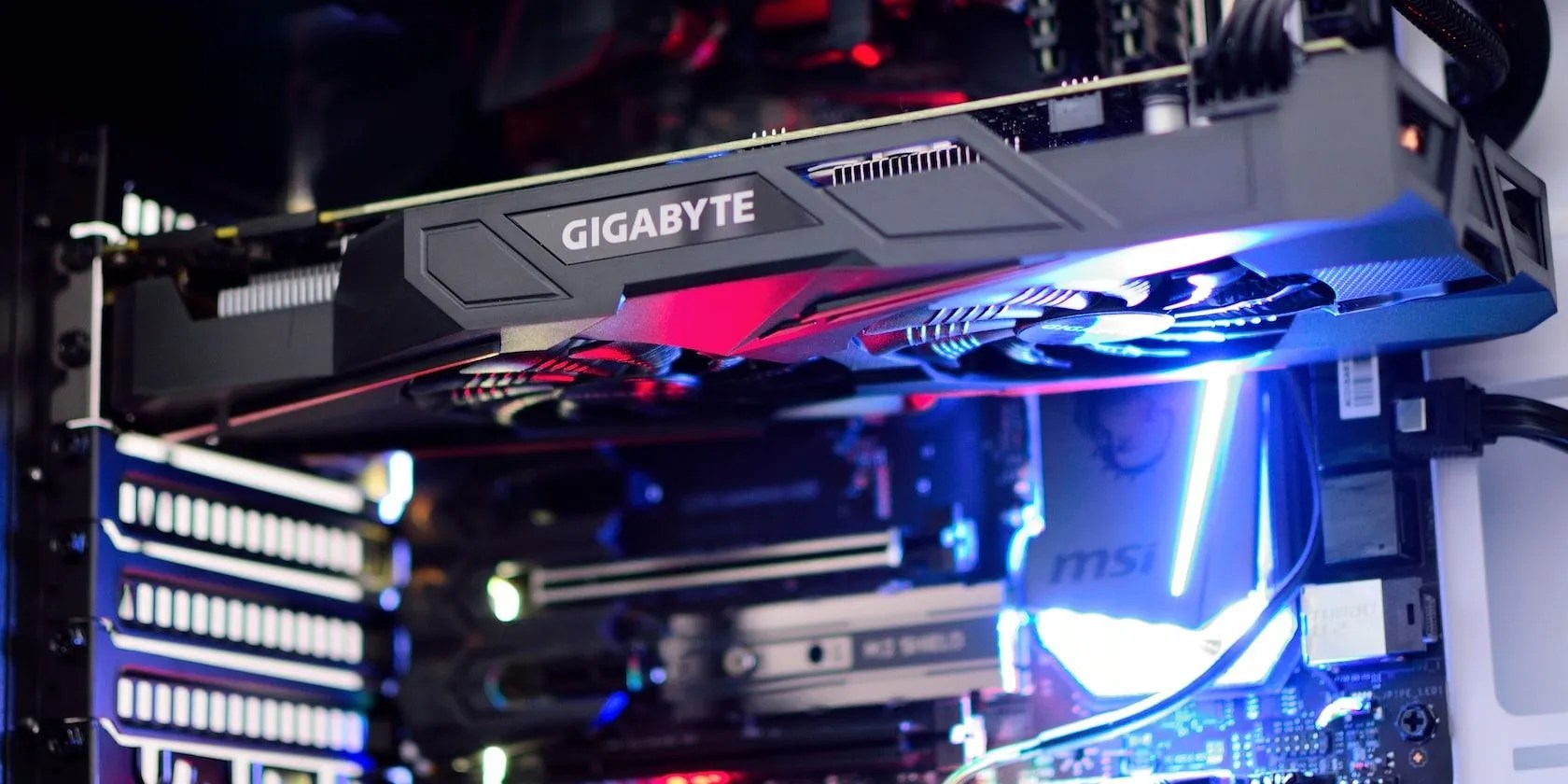 A GPU Plugged in a Running PC Case.