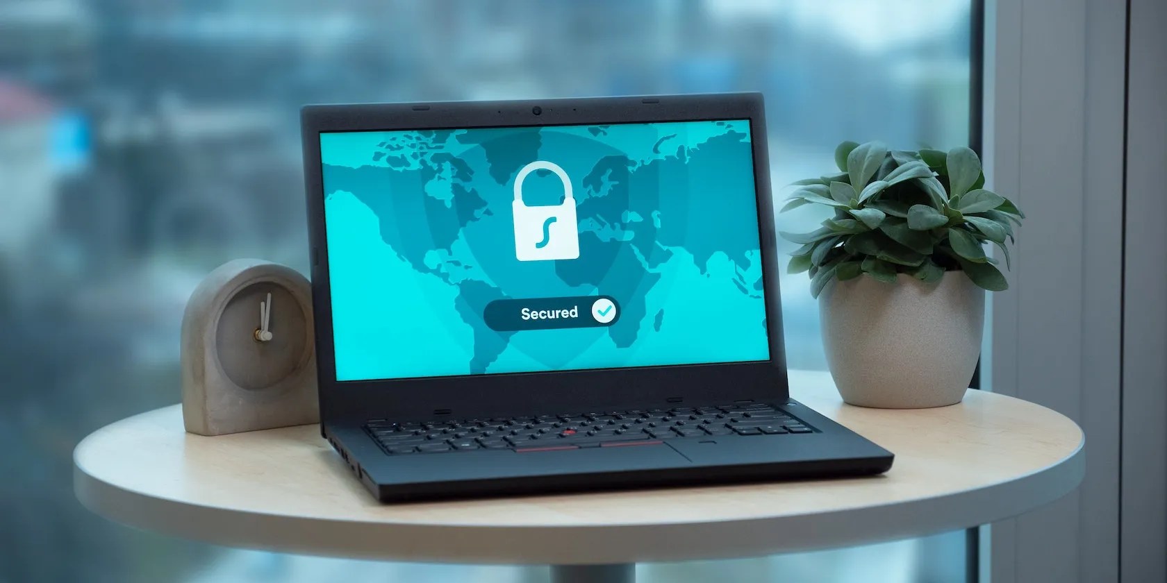 Laptop on a Table With a Lock Icon on the Screen