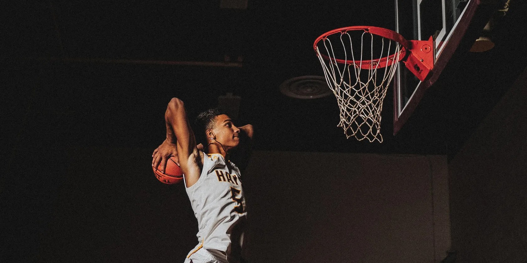 basketball player going in for a dunk