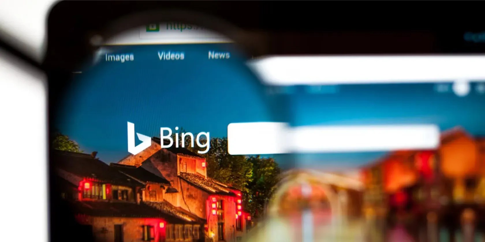 Bing search engine on laptop through glasses lens