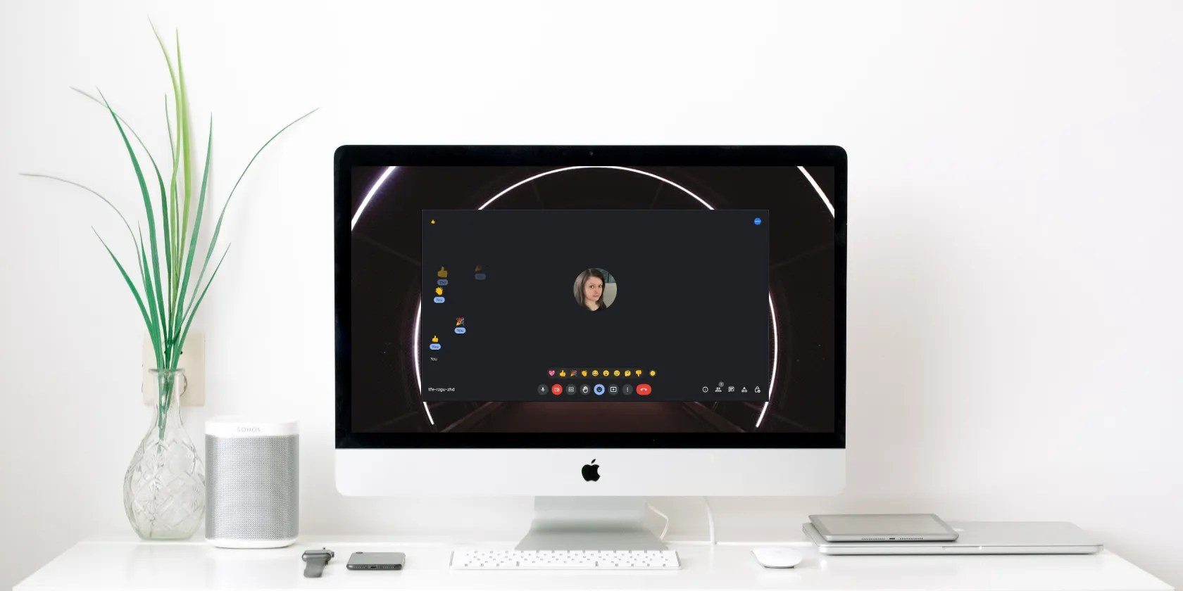 Computer with meeting software on display