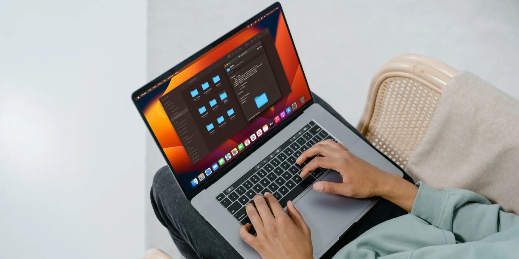 man accessing folders on a MacBook