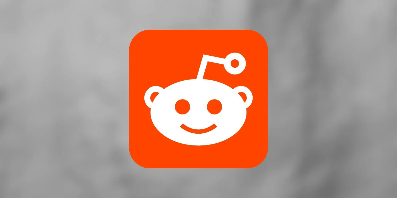 Reddit logo seen on grey background
