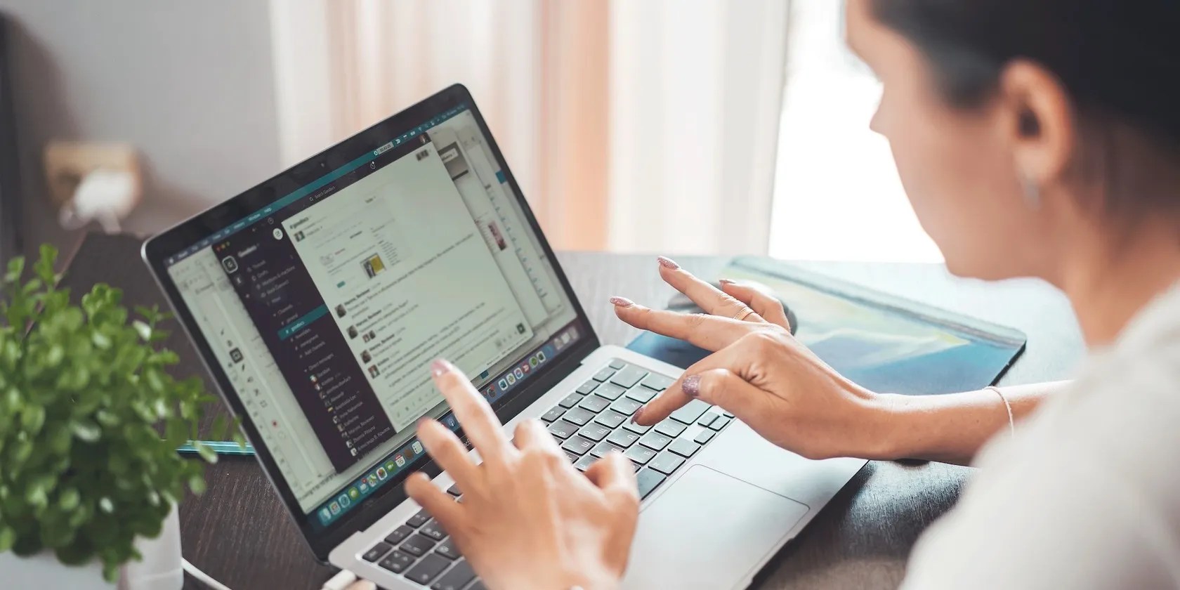 A Woman Reading Messages on Her Computer