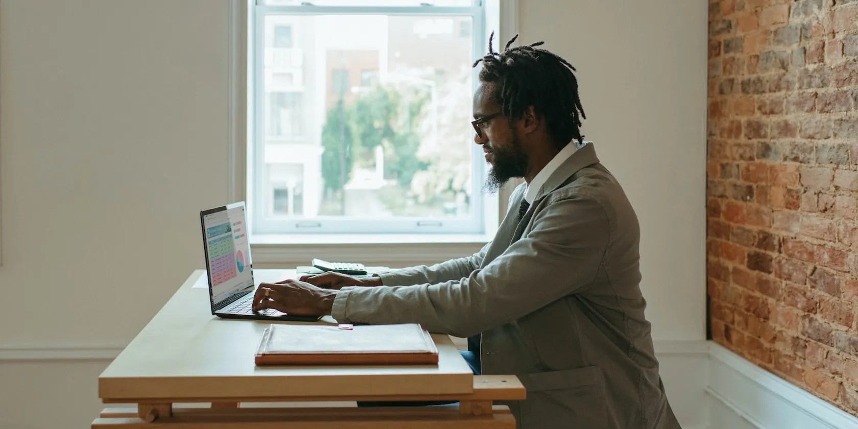 Man Seriously Typing Laptop