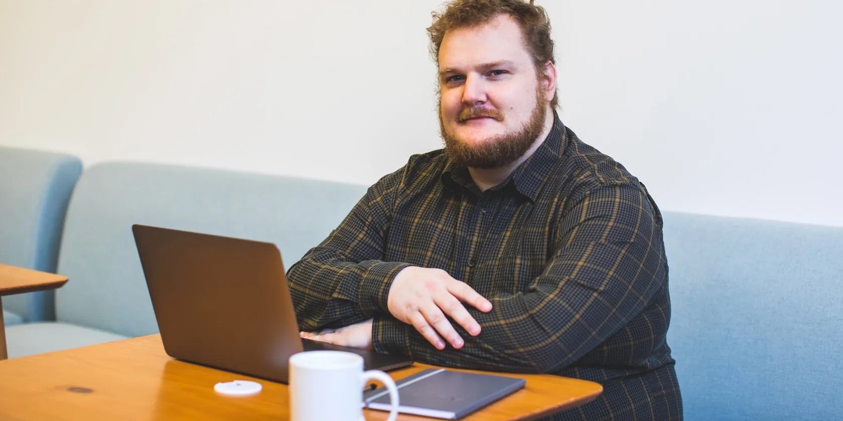 Man Seated at a Work Desk