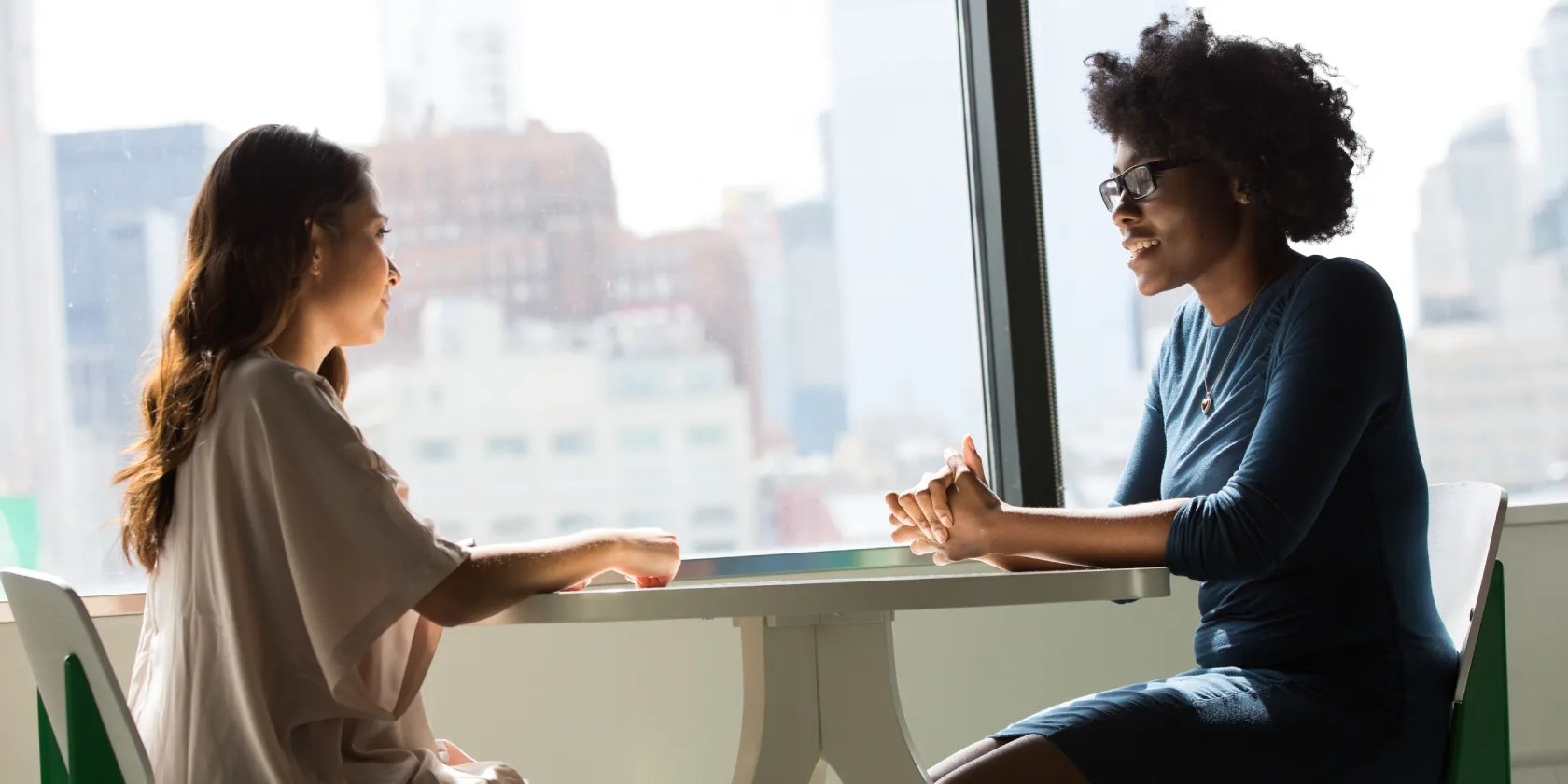 two people talking at a table