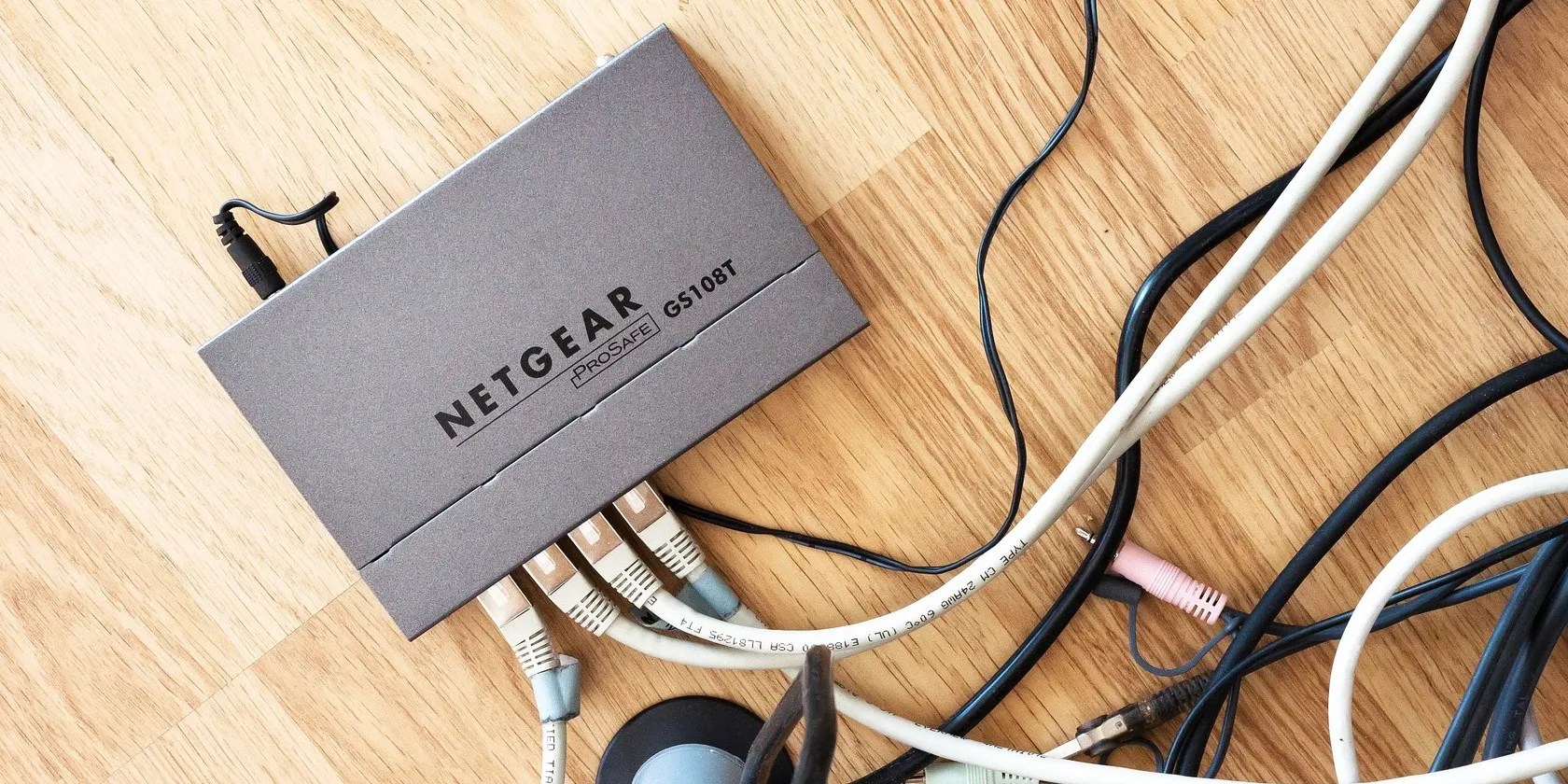 router placed on table with wires connected into it