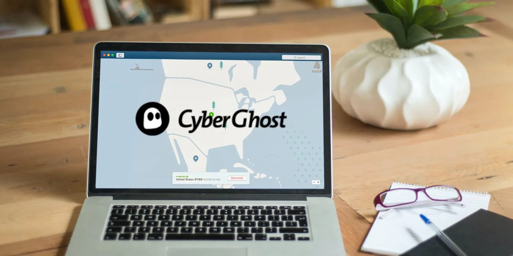 cyberghost logo on laptop screen on desk