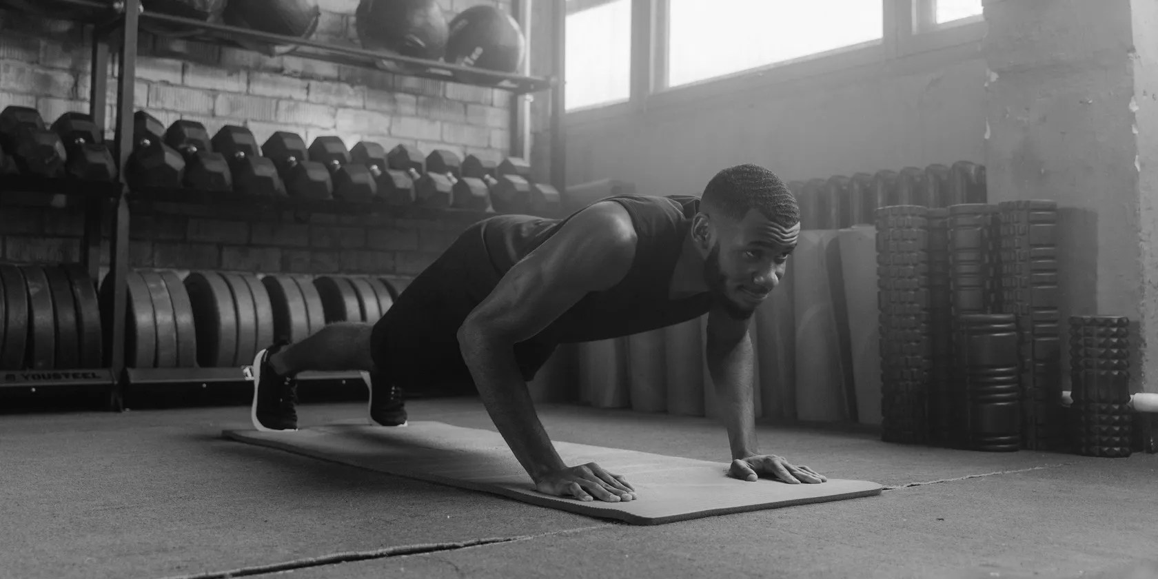man in gym doing push-ups