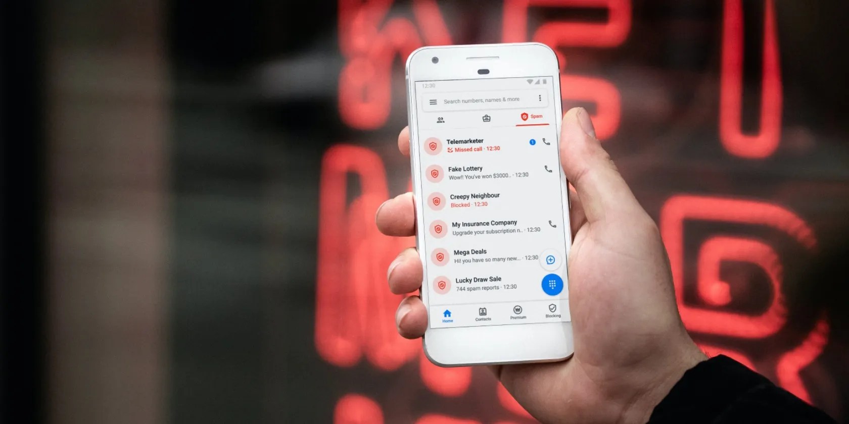 person holding a phone with missed calls