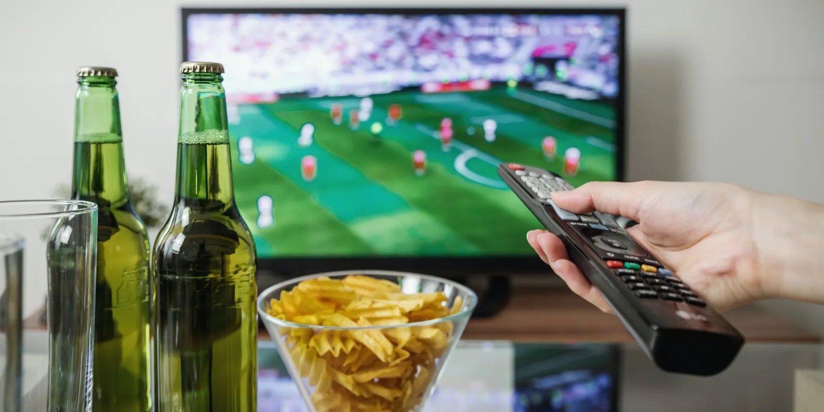 Watching a soccer game, snacking