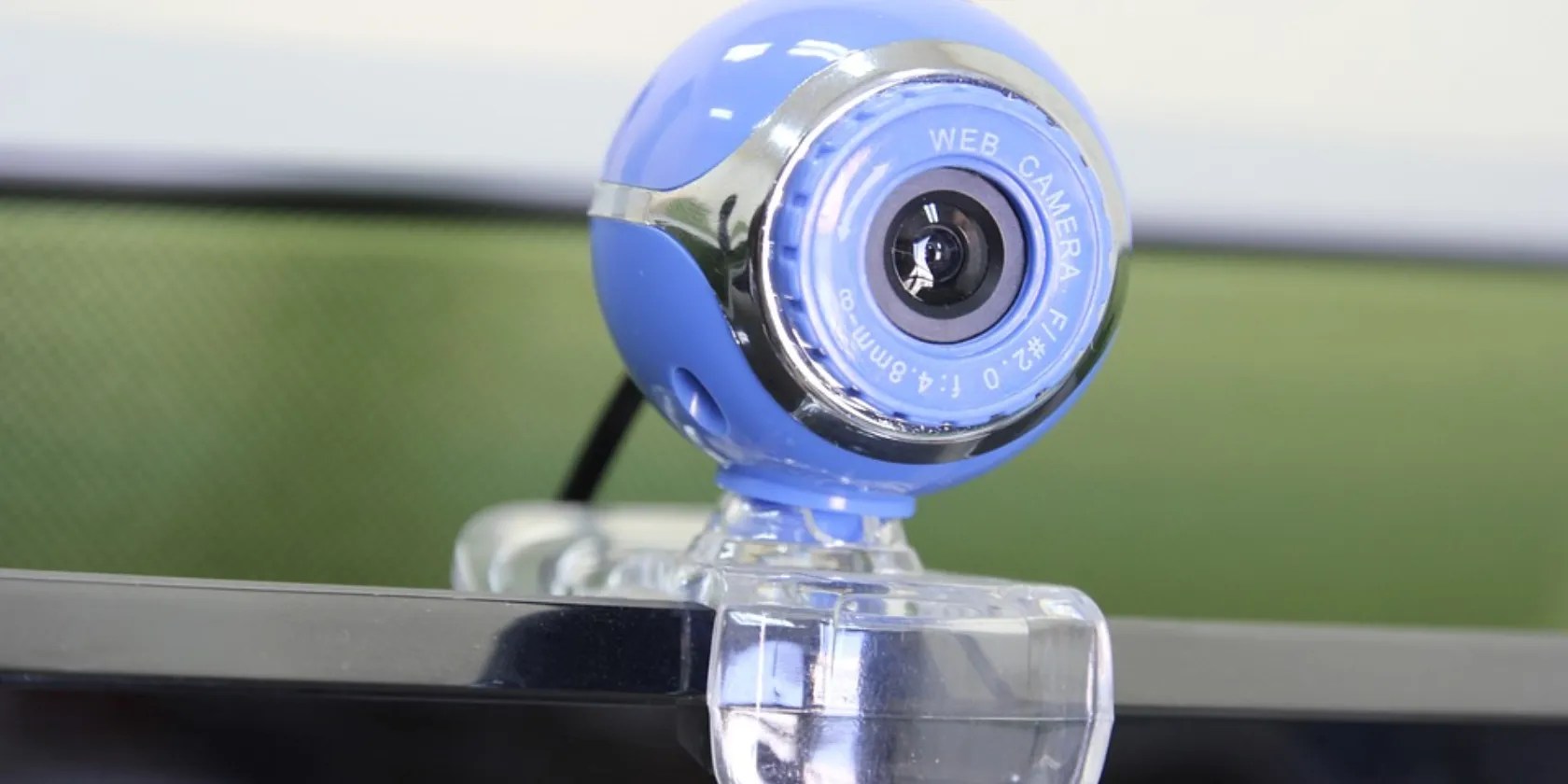 a web camera attached on top of a laptop