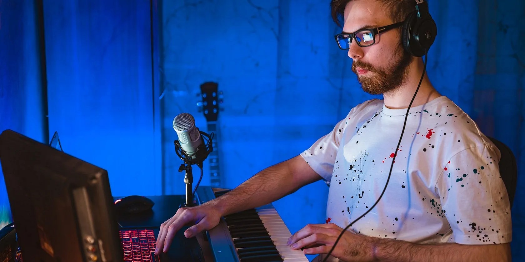 A man editing audio on a PC