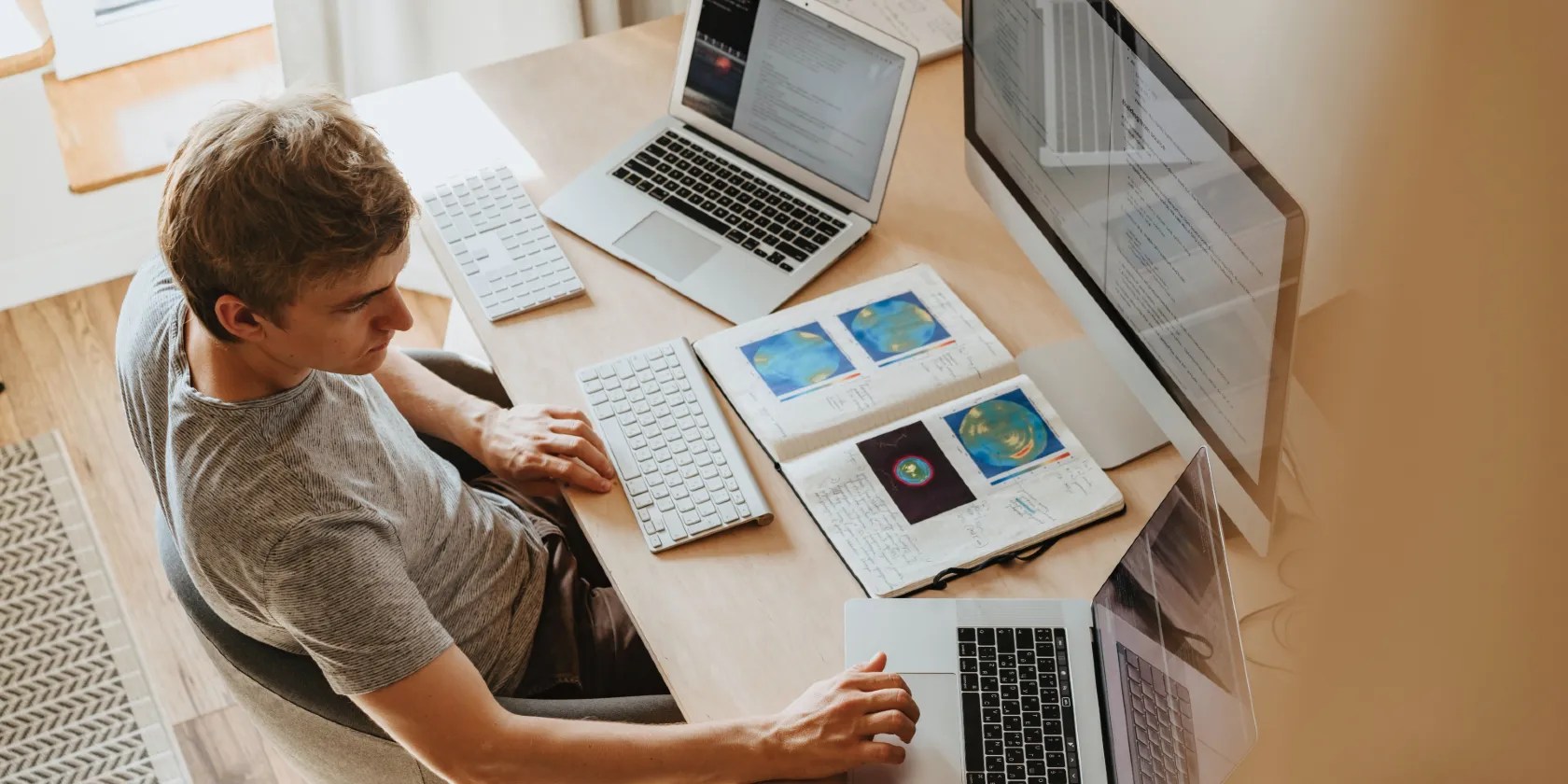 Man Using 3 Computers
