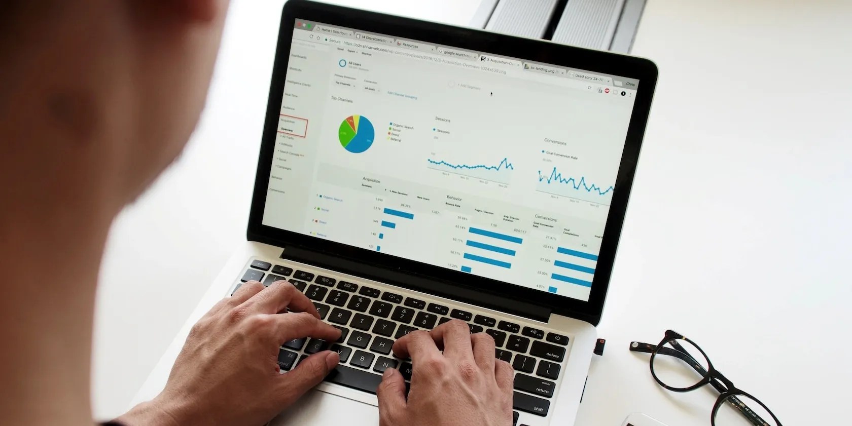 Person creating graphs on laptop