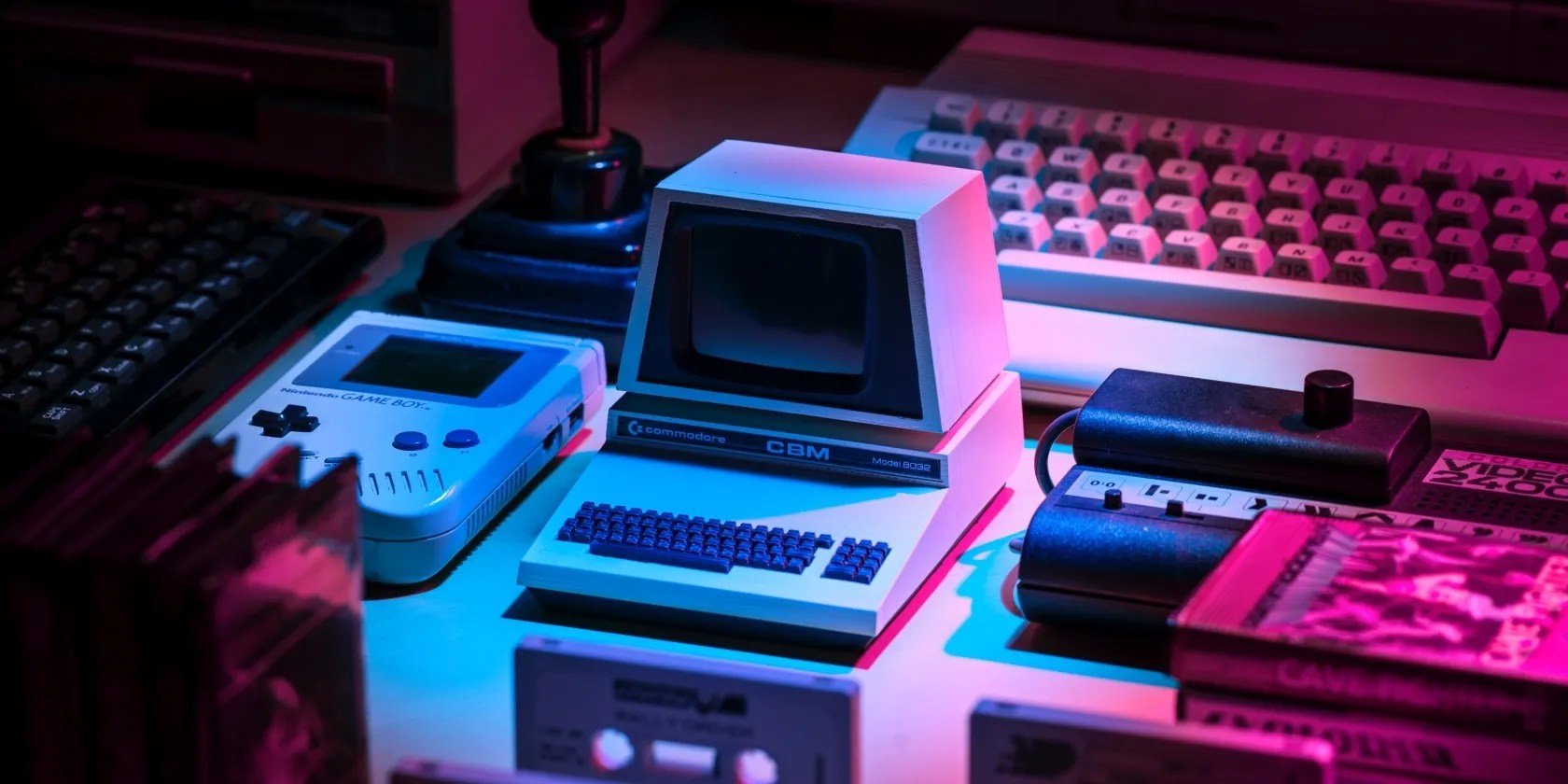 A photograph of various retro gaming consoles arranged next to each other