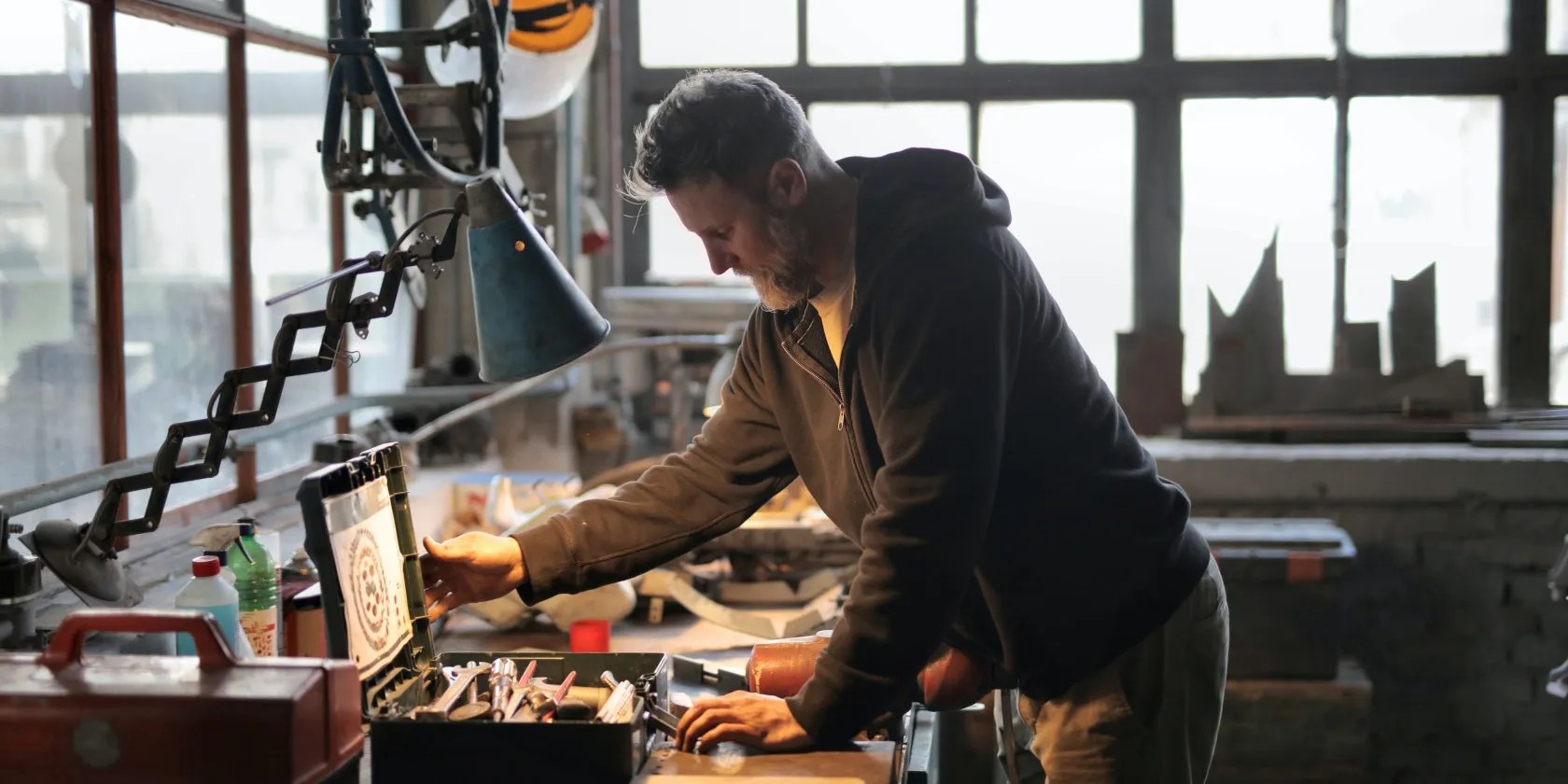 Man looking in toolbox