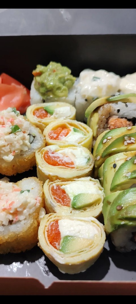 A few pieces of sushi in a box