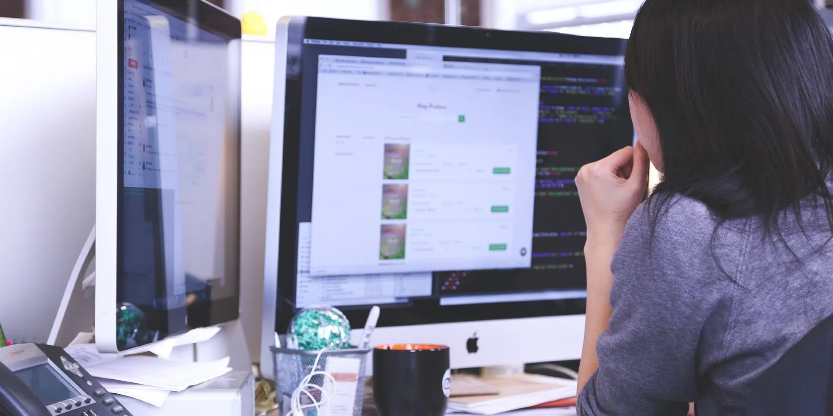 Woman working on a Mac desktop