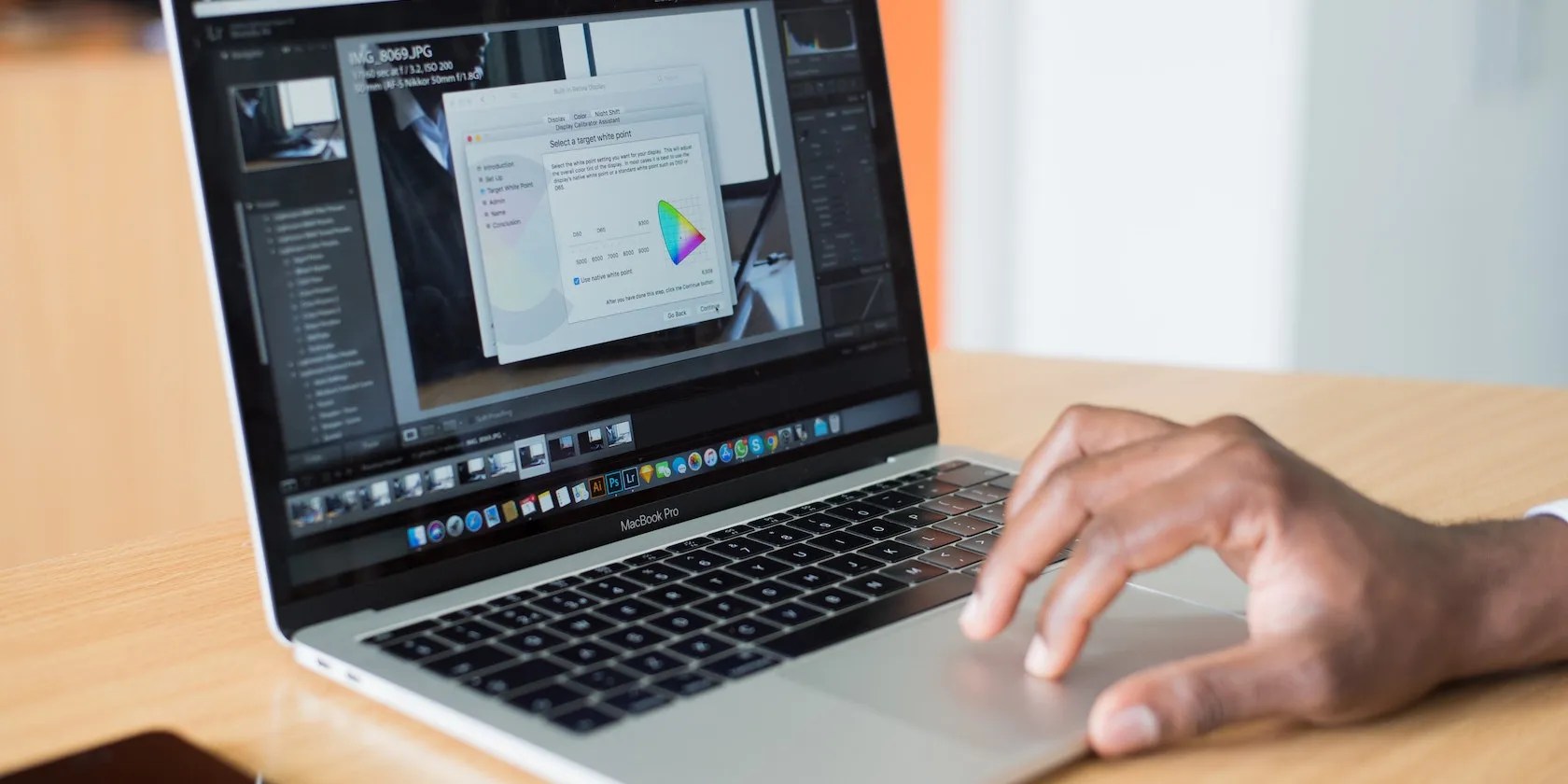 A macbook screen with apps open and a visible dock