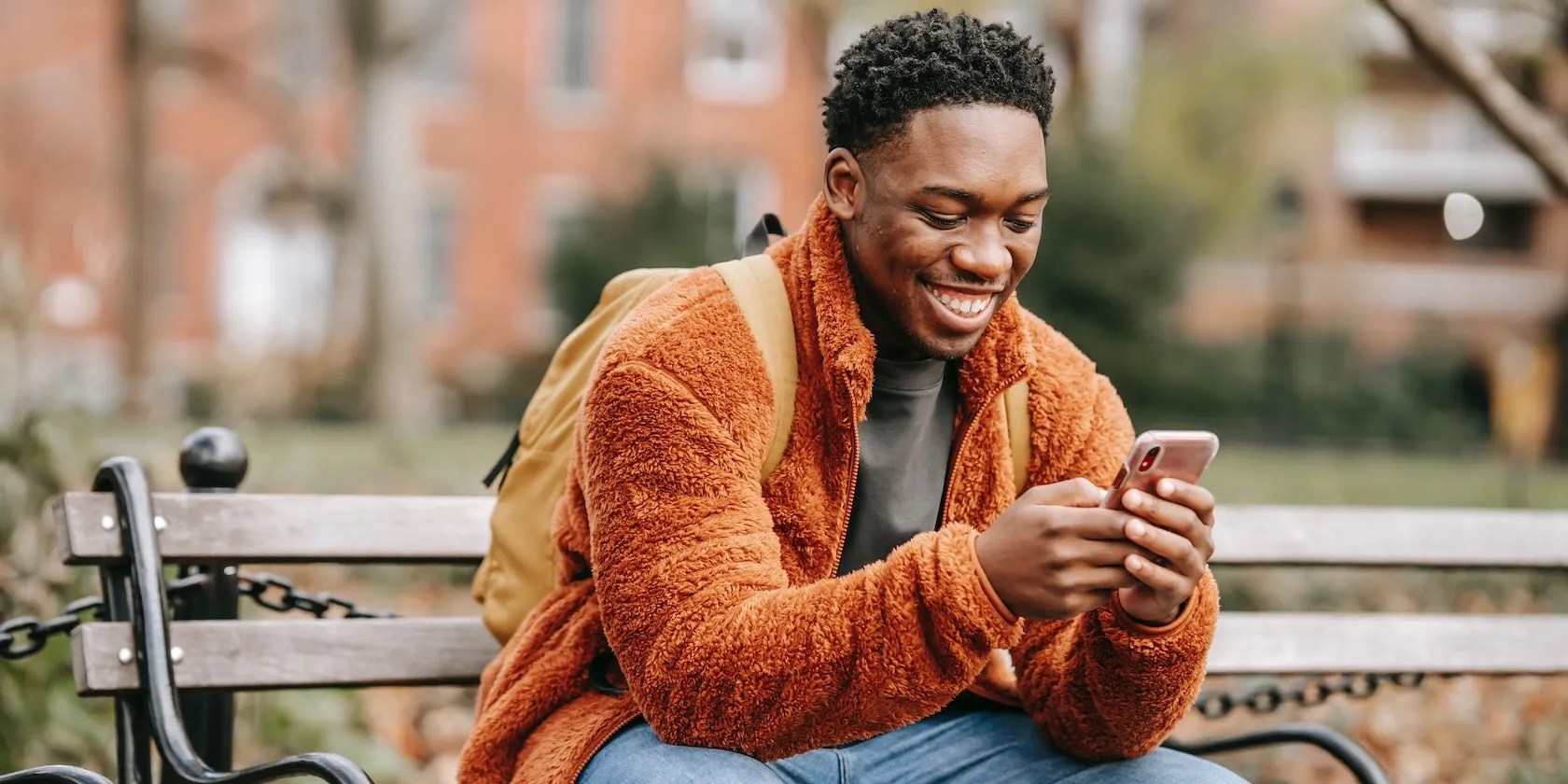 Man chatting on smartphone outside
