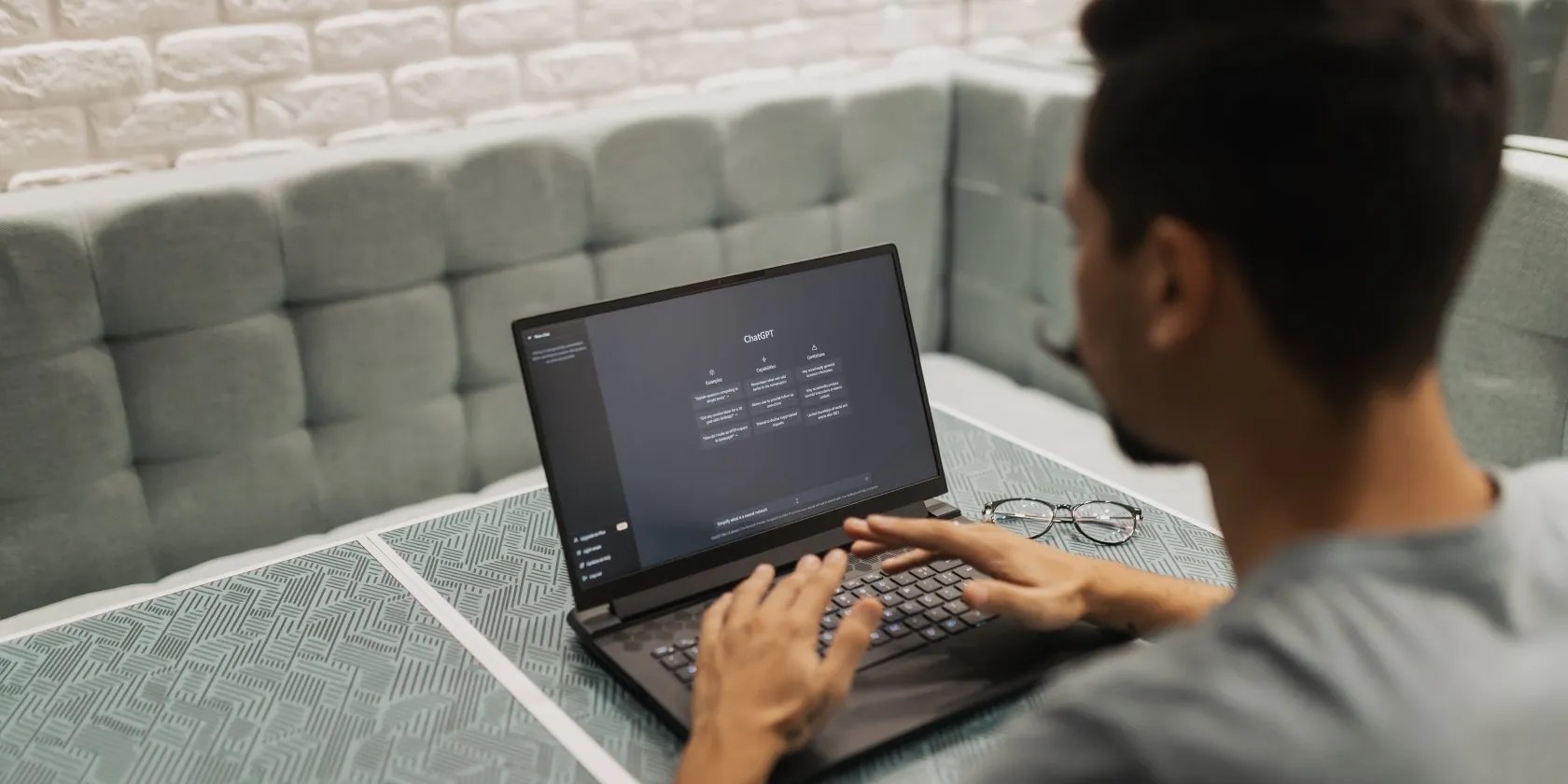 Man on laptop with ChatGPT open