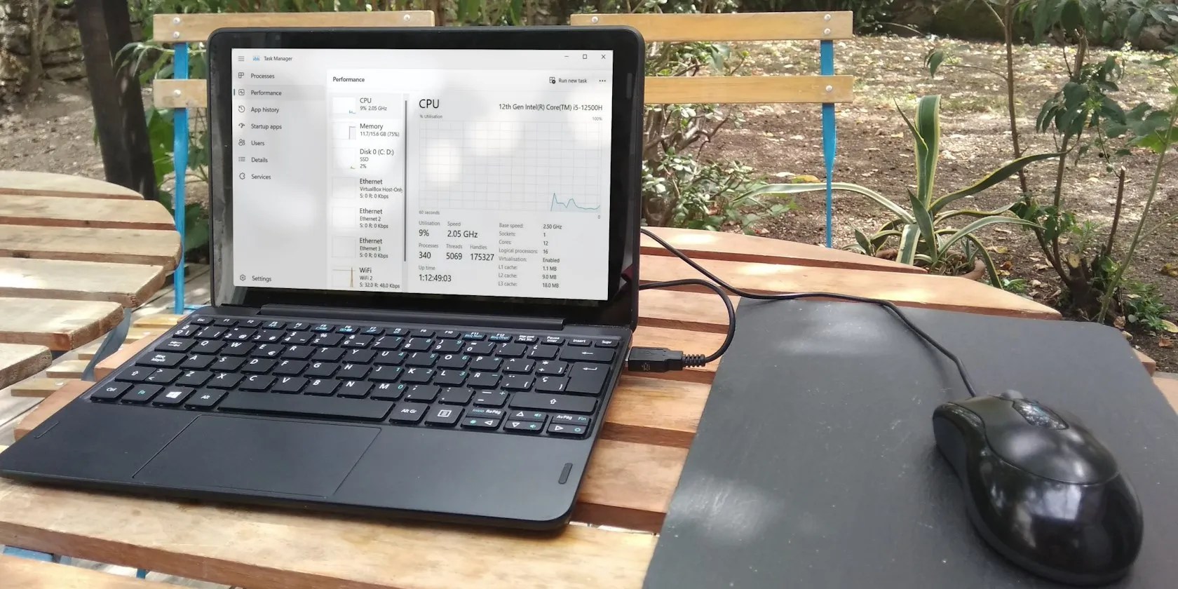 Task manager showing on a Windows laptop on a table outside