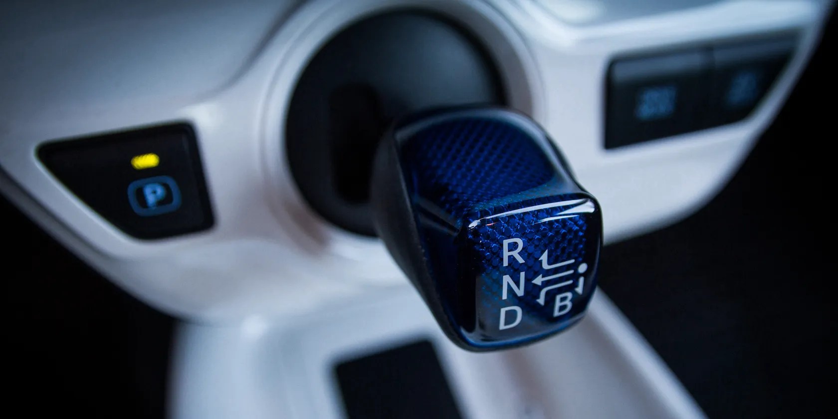 Toyota Prius blue-colored, dashboard mounted gear shift