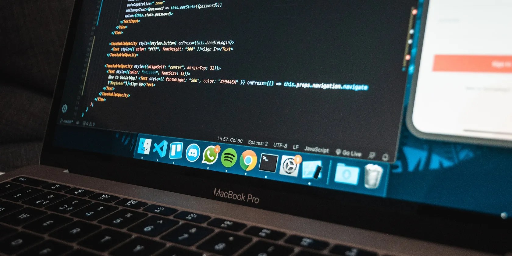 MacBook Pro laptop with program code on screen