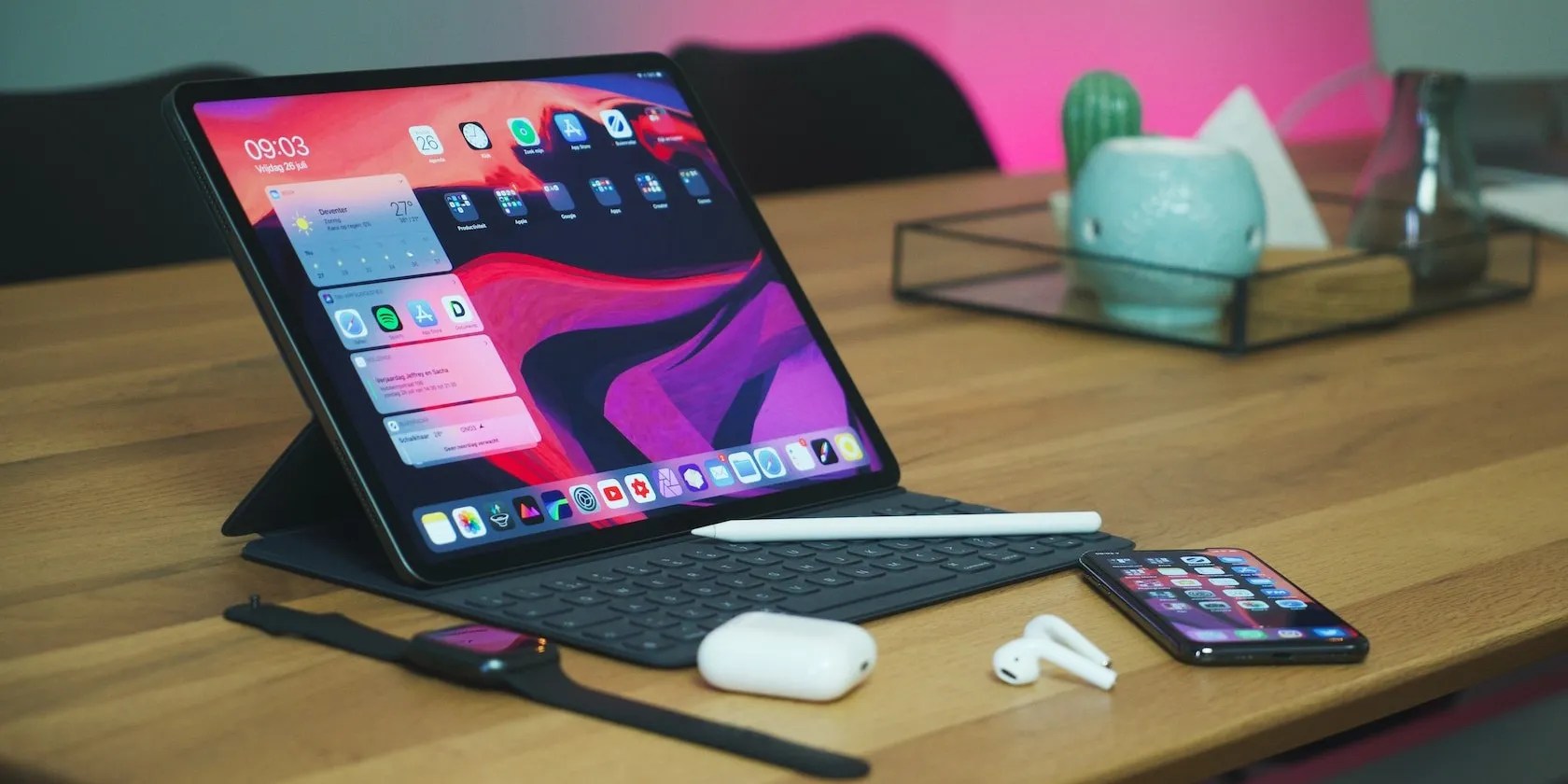 iPad on a Table With an iPhone and AirPods