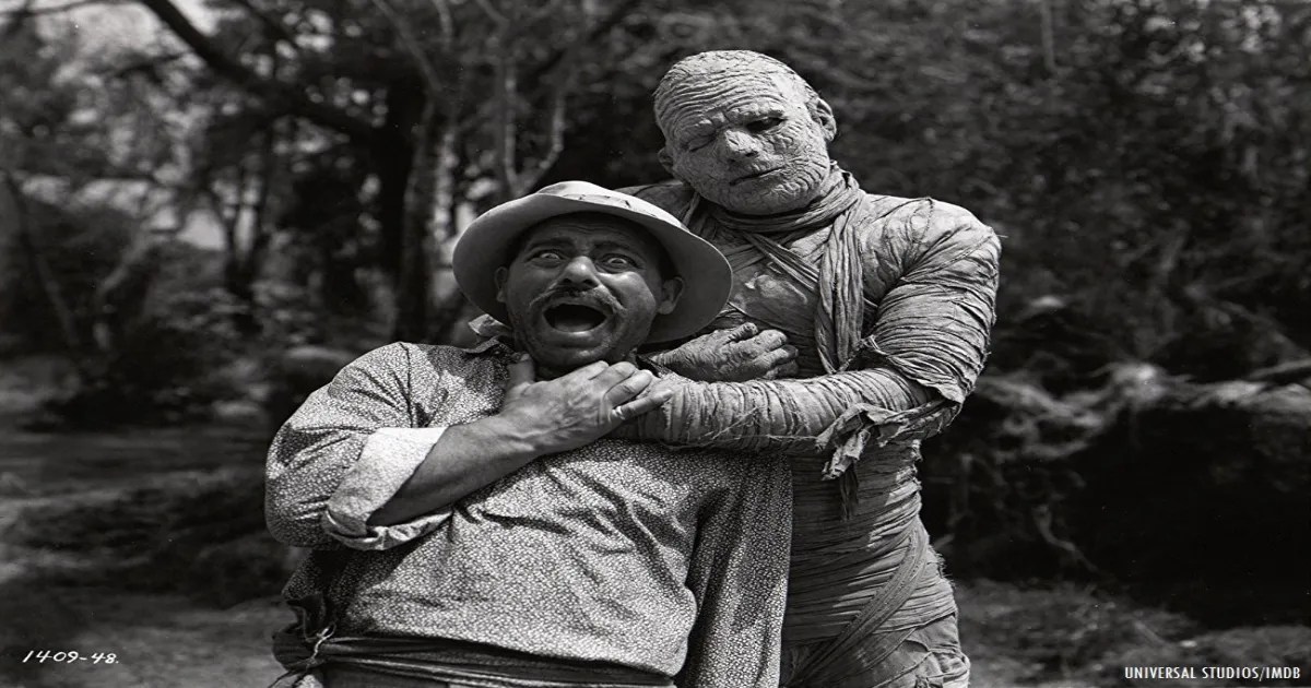 A mummy&rsquo;s hand wrapped around a man&rsquo;s neck