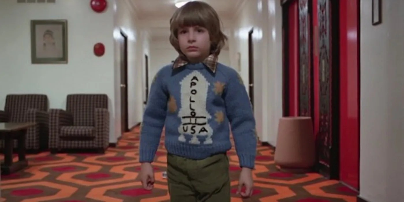 Danny Lloyd as Danny Torrance wearing an Apollo 11 sweater in Stanley Kubrick&rsquo;s film adaptation of Stephen King&rsquo;s The Shining