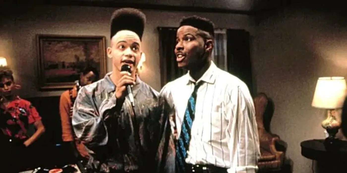 Two Characters Standing with a Microphone in House Party 1990