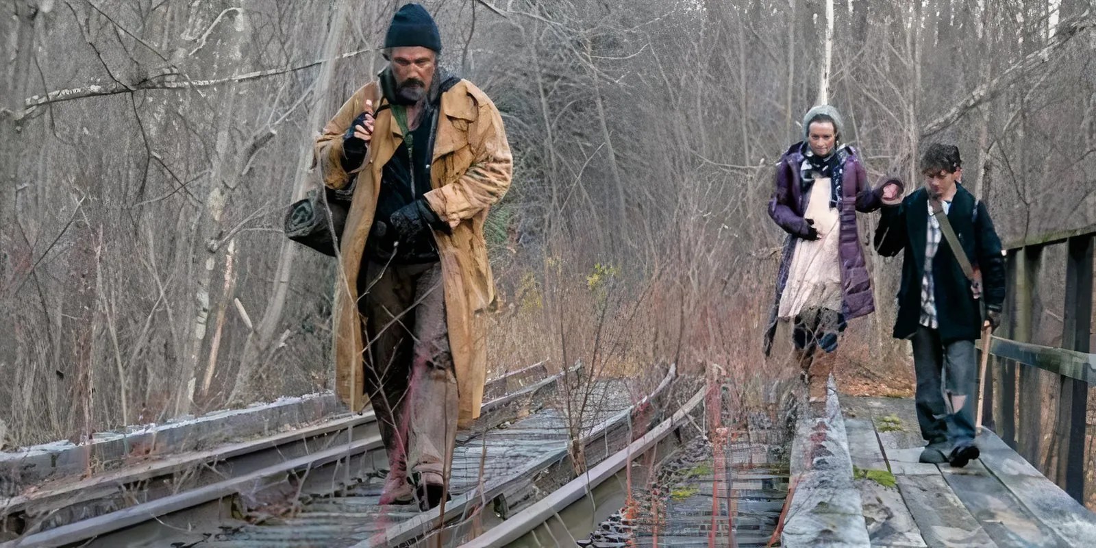 Stake Land characters walking on traintracks in the woods