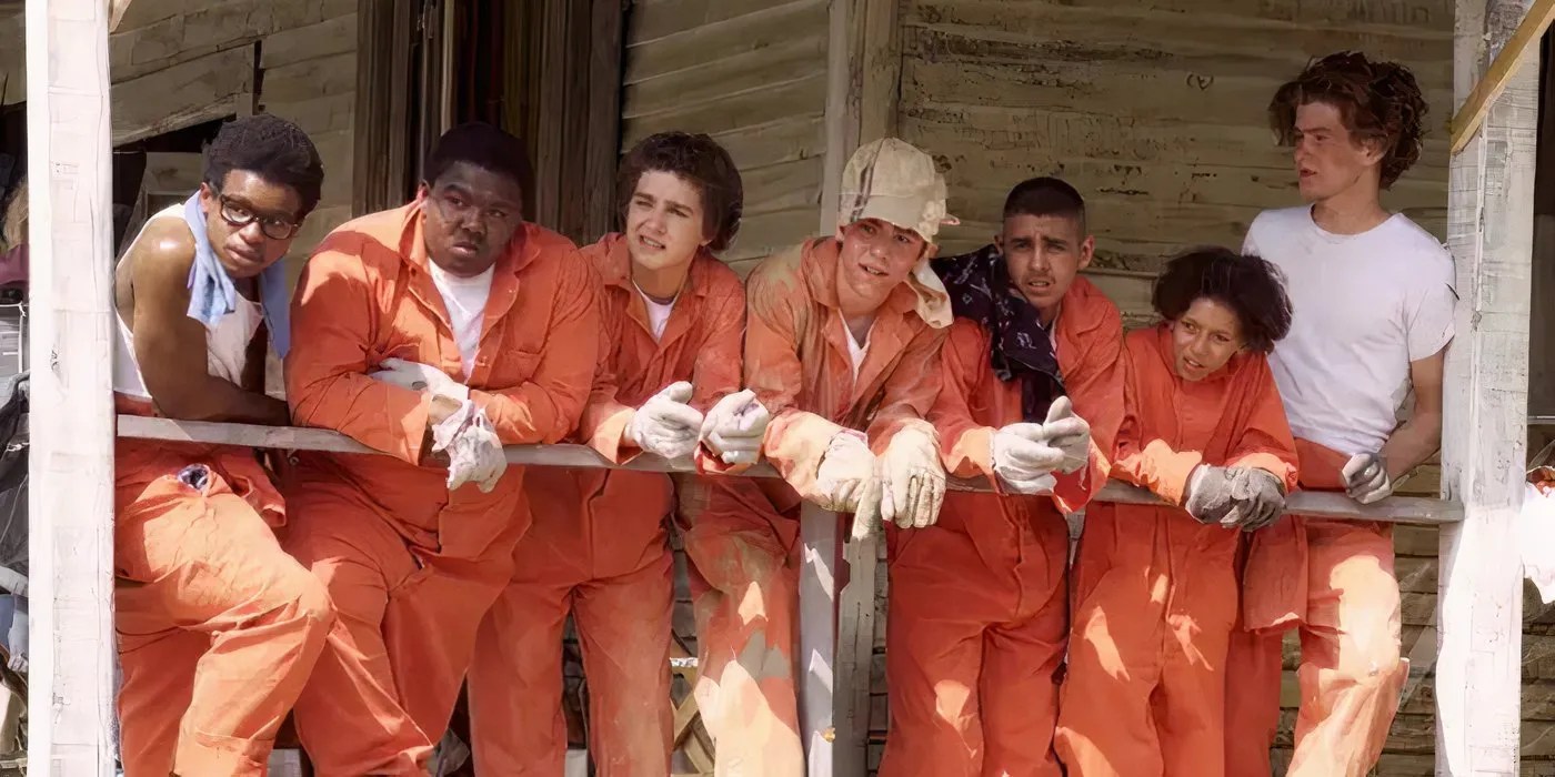 A group of young boys, including Shia LaBeouf, in orange tracksuits for Holes (2003)