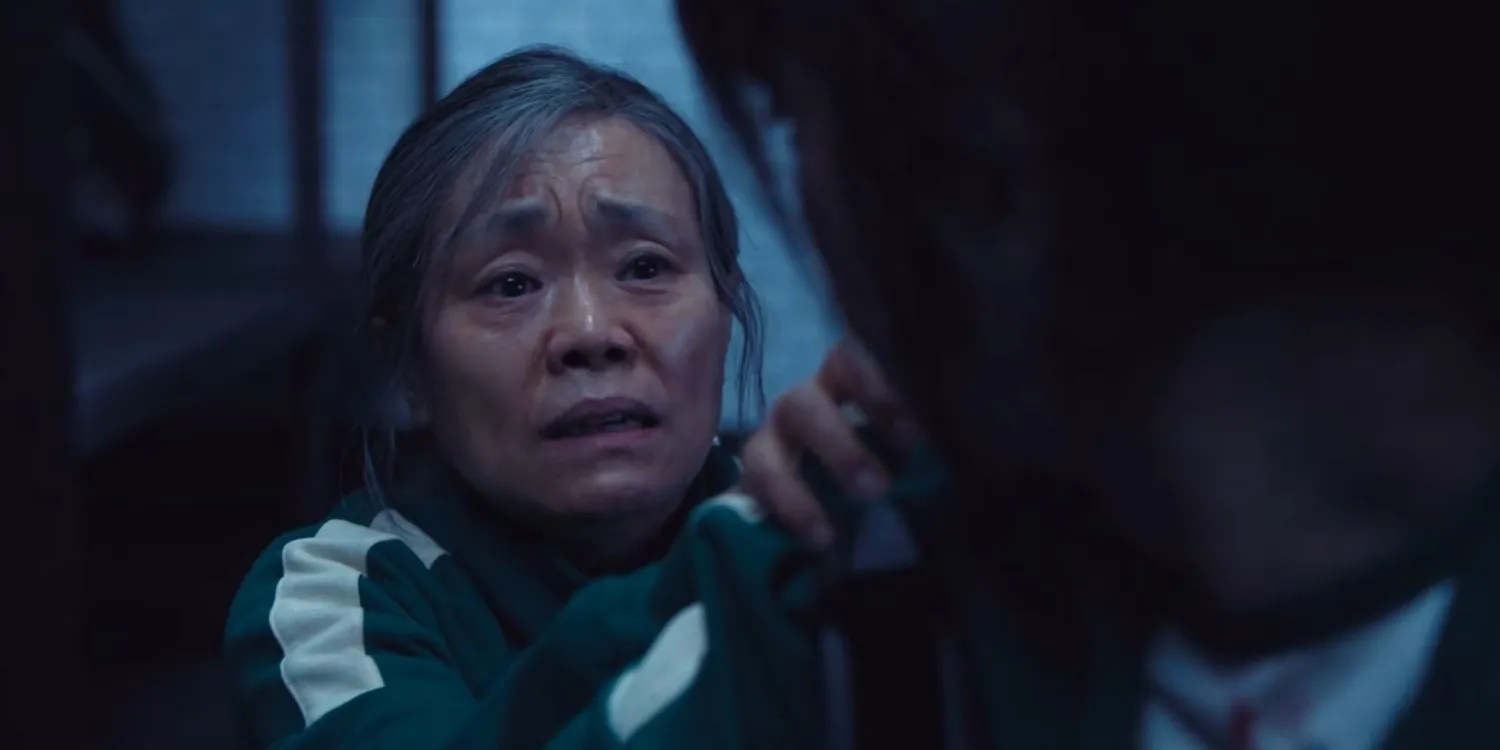 Geum-ja looks at Hyun-ju imploringly in Squid Game