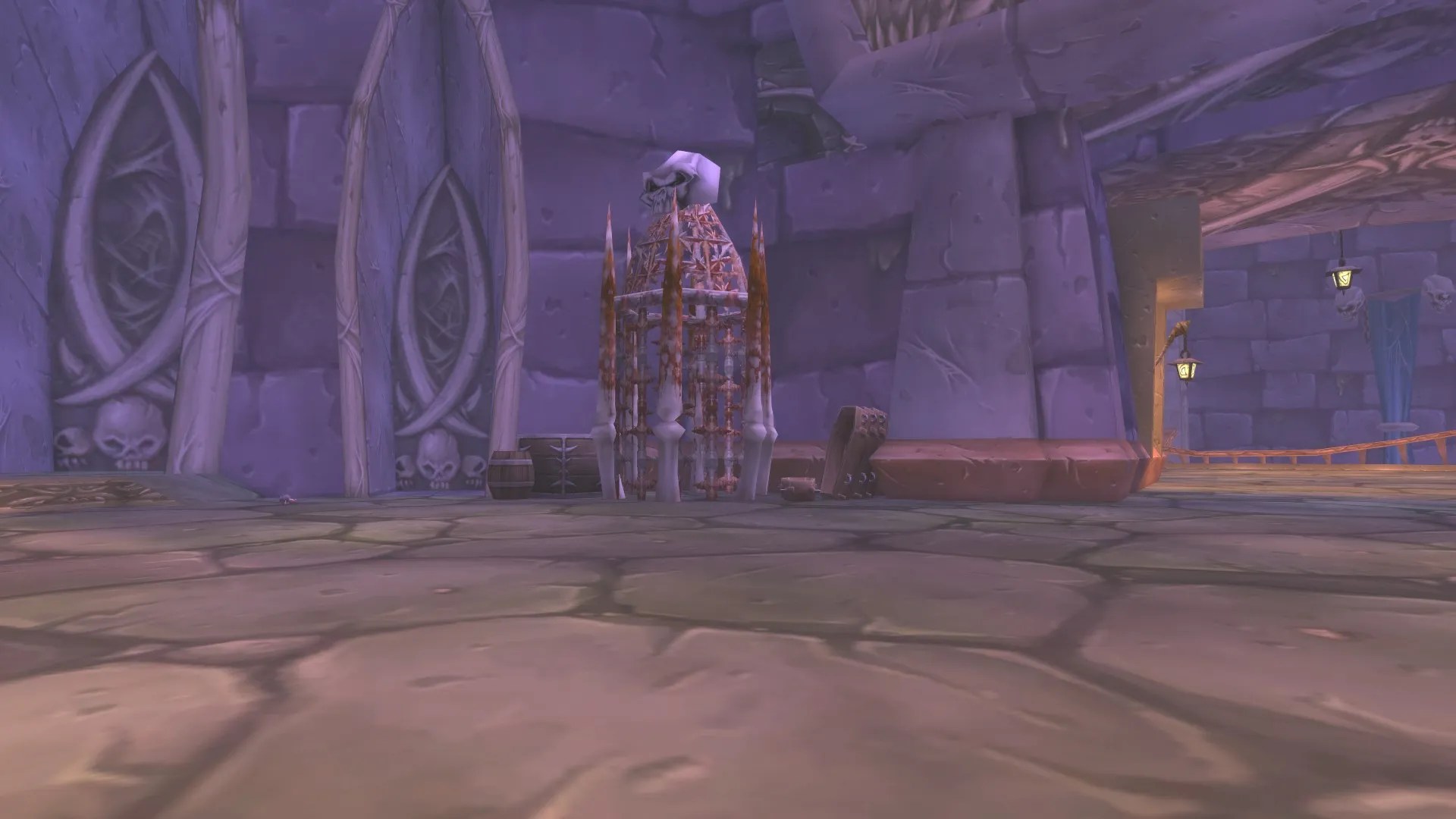 A bone cage against a stone wall within the dread citadel of Naxxramas