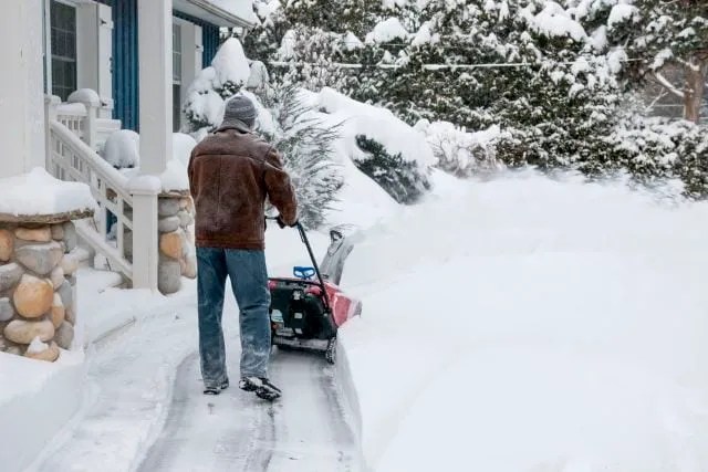 Man using snowblower