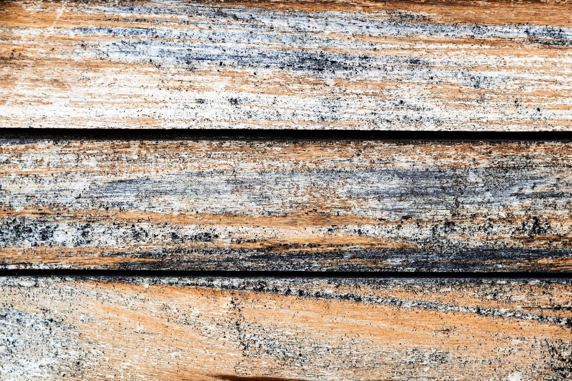 Weathered old striped texture of wooden boards-a natural background pattern of treated wood